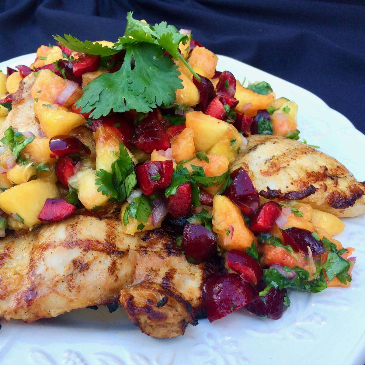 Juicy Grilled Chicken Thighs with Fresh Peach and Cherry Salsa